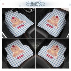 Four-piece set of cute cartoon car floor mats featuring a teddy bear design on blue gingham, perfect for all-season use and a...