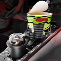 Dual car cup holder bracket with adjustable extender, holding a can and a cup in a cars center console.
