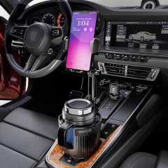 Factory-direct car cup holder and phone mount in action, securely holding a mug and smartphone in a modern vehicles center co...