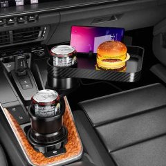 Rotatable car cup holder & phone mount in action, holding drinks and a burger, with a phone stand, all in a sleek car interio...