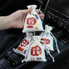 Hand holding nano-mineral bamboo charcoal car bags with natural design, ideal for formaldehyde removal and freshening car int...