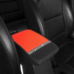 Elegant snowflake rhinestone armrest mat with vibrant orange quilted design and black leather accents, perfect for all-season...