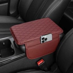 Leather quilted car armrest box mat in rich burgundy, featuring a sleek design with a phone holder and storage pocket, perfec...