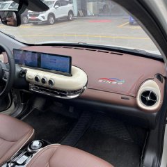 Stylish wuling bingo leather key cover case displayed inside a modern car dashboard, showcasing elegant design and functional...