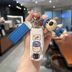 A hand holds a mazda car key cover featuring a cute cartoon dog design, compatible with models like cx-4, cx-5, and mazda6, s...