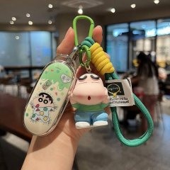 A hand holds a li auto l9 key cover featuring a cute cartoon design with a green and yellow rope keychain, perfect for l8, l7...