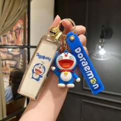 A hand holds a doraemon-themed car key shell case for wey vv7, featuring a blue doraemon charm and a matching keychain with d...