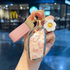 Elegant roewe rx5 plus car key cover featuring a floral design, pink leather strap, and decorative flower charm, compatible w...
