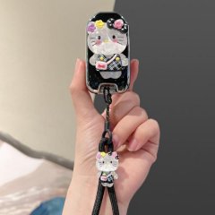 A hand holds a stylish honda key cover featuring a cute hello kitty design with floral accents and a matching charm, perfect ...