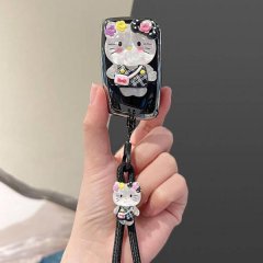 A hand holds a volkswagen magotan b8 key cover featuring a cute hello kitty design with floral accents and a matching keychai...