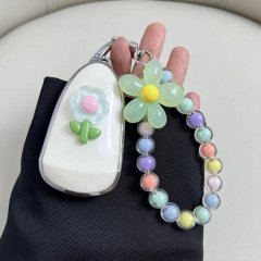 Wey blue mountain key cover featuring a floral design with a pastel flower and green leaves, paired with a colorful beaded ke...