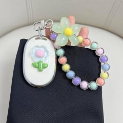 Aima electric scooter key cover featuring a playful design with a pastel flower and colorful beaded bracelet, perfect for the...