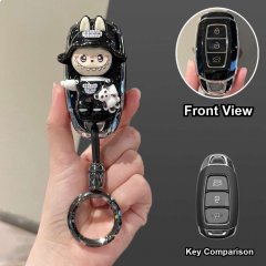 Hand holding a hyundai key cover featuring a cute cartoon character design, with front view and key comparison shown.