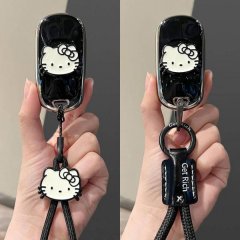 Hello kitty-themed key cover for buick vehicles, featuring a stylish black design with a cute bow and get rich charm.