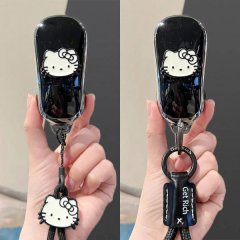 Elegant black silicone car key cover featuring a cute hello kitty design, paired with a stylish get rich keychain, perfect fo...