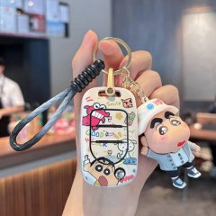 A hand holds a wuling hongguang mini ev key cover featuring a colorful cartoon design with smile text and a cute character ch...