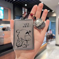 A hand holds a roewe nfc card key cover featuring a cartoon bear with the text and a cat-shaped charm, designed as a...