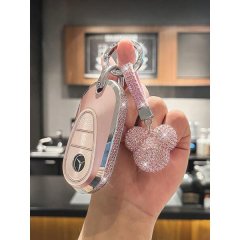 A hand holds a pink mercedes-benz key cover with a sparkling mickey mouse charm, designed for c-class, e-class, glc, cle, and...