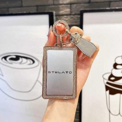 A hand holds a stylish hima s9t nfc card key cover for huawei aito s9 electric car, featuring a silver stelato design with di...