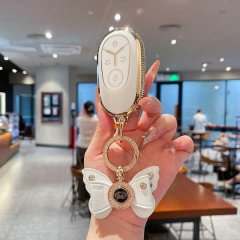 Elegant geely galaxy starry wish key cover for women, featuring a butterfly charm and sparkling details, showcased in a moder...