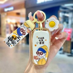 A hand holds a stylish key cover for red flag h5/h7/hs5/h9, featuring a cartoon design with the phrase you will be a little r...