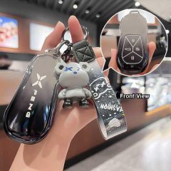 Xiaopeng p7 key cover featuring a soft-touch tpu case with a stylish bear charm and wrist strap, shown in front view with det...