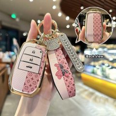 Elegant toyota key cover for camry, corolla & rav4, featuring premium leather with a pink monogram design and a decorative ke...
