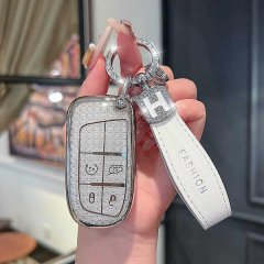 Elegant jeep leather key fob cover for compass, cherokee, and grand cherokee, featuring a stylish h charm and fashion strap.