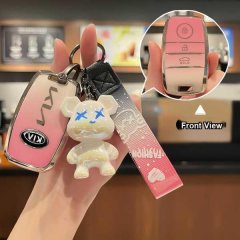 Stylish kia key cover for k3, sportage, seltos, featuring a pink gradient design with a playful bear charm and front view det...