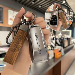 Hand holding a sleek bj40 x7 magic cube key cover for beijing auto, featuring a wooden tag and front view of the key fob in a...