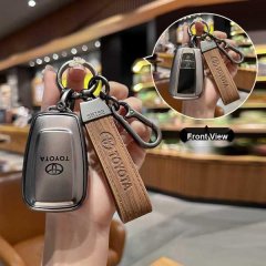 Elegant toyota key cover for women, featuring a sleek metal design and wooden strap, compatible with corolla, camry, rav4, an...