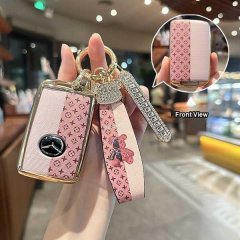 Elegant pink key cover for mazda 3, featuring a stylish pattern and a decorative strap with a teddy bear design, perfect for ...