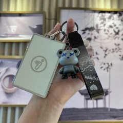 A hand holds a sleek ninebot b30c/b80/c60/n70c nfc card holder with a cartoon bear keychain, featuring a minimalist design an...