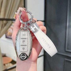 Elegant nissan key cover for sylphy, qashqai, teana, and x-trail, featuring a sleek silver design with a fashion leather stra...