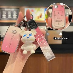 Volkswagen key cover in pink with a bear charm, featuring a front view of the key fob for jetta, passat, tiguan, and golf mod...