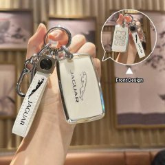 Elegant jaguar key cover for range sport, f-pace, e-pace, and f-type, featuring a sleek white design with a leaping jaguar lo...
