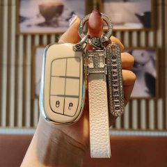 Elegant fiat viaggio key cover featuring premium genuine leather with a sleek design, adorned with a sparkling keychain and n...