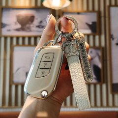 Elegant beige key cover for beijing auto x35 models, featuring a sleek design with a decorative keychain and numbered charm, ...