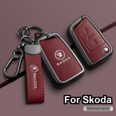 Elegant red leather key cover for skoda models, featuring a sleek design with embossed logo and durable metal hardware. perfe...
