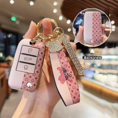 Elegant rongwei i5 key cover featuring a pink monogram design, adorned with a sparkling teddy bear charm and gold accents, sh...