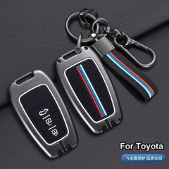 Protect your toyota key with a sleek metal cover featuring red, blue, and white stripes, designed for camry, rav4, corolla, a...