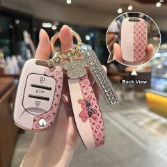 Elegant wuling mini ev key cover with soft tpu material, featuring a stylish pink pattern and decorative charm, offering slim...