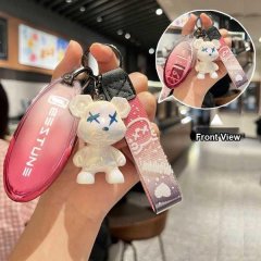 Premium benteng t77 key cover featuring a full-body silicone shell with a cute bear charm and stylish wrist strap, showcased ...