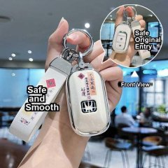 A hand holds a sleek white honda cr-v key cover (2021-2024 smart edition), showcasing its front view with a smooth finish and...