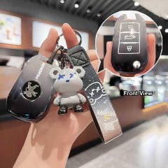 A hand holds a peugeot tpu key cover for 308, 2008, 3008 & 508, featuring a stylish design with a bear charm and a front view...