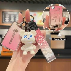 A hand holds a pink skoda key cover for models like octavia, superb, rapid, and yeti, featuring a cute bear charm and a styli...