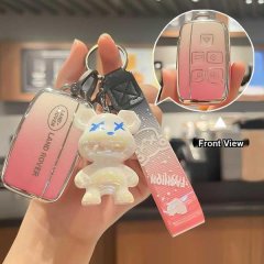 Elegant land rover key cover with gradient pink design, featuring a stylish bear charm and front view of the remote buttons f...