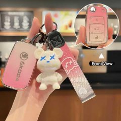 Skoda key cover for octavia, superb, kamiq & kodiaq, featuring a pink gradient design with a bear charm and front view detail...