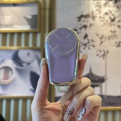 A hand holds a sleek, lavender starway yaoguang cdm key cover for men, featuring a metallic finish and four functional button...