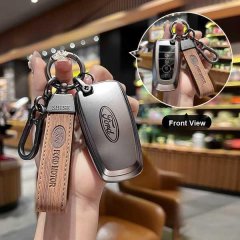 Ford key cover for mondeo, focus & explorer: sleek metallic design with leather strap and shise branding, shown in front view...